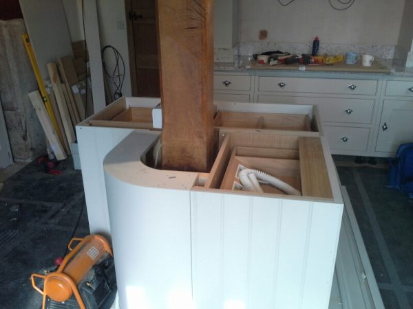 Fitting seamless worktops around old oak beam?