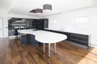 Corian® curved island with large breakfast bar